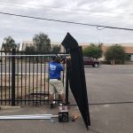 The DCS Industries team installs a wrought iron commercial security gate.