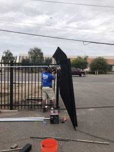 The DCS Industries team installs a wrought iron commercial security gate.