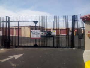 Wrought iron rolling security gate secures a self-storage facility