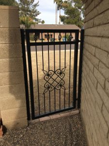 DCS Industries custom wrought iron gate secures a home's entryway.