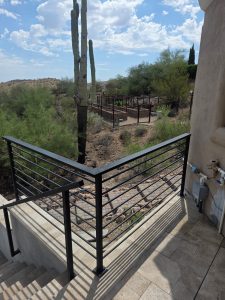 wrought iron railings on patio in desert landscape